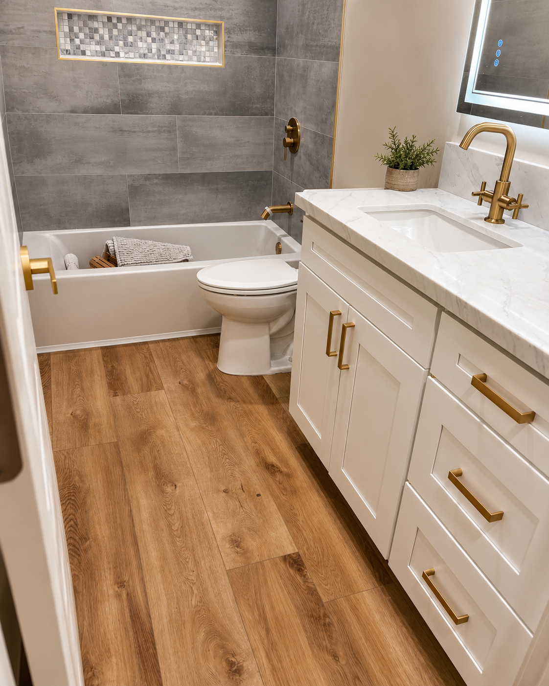 Bathroom remodel with gold fixture accents