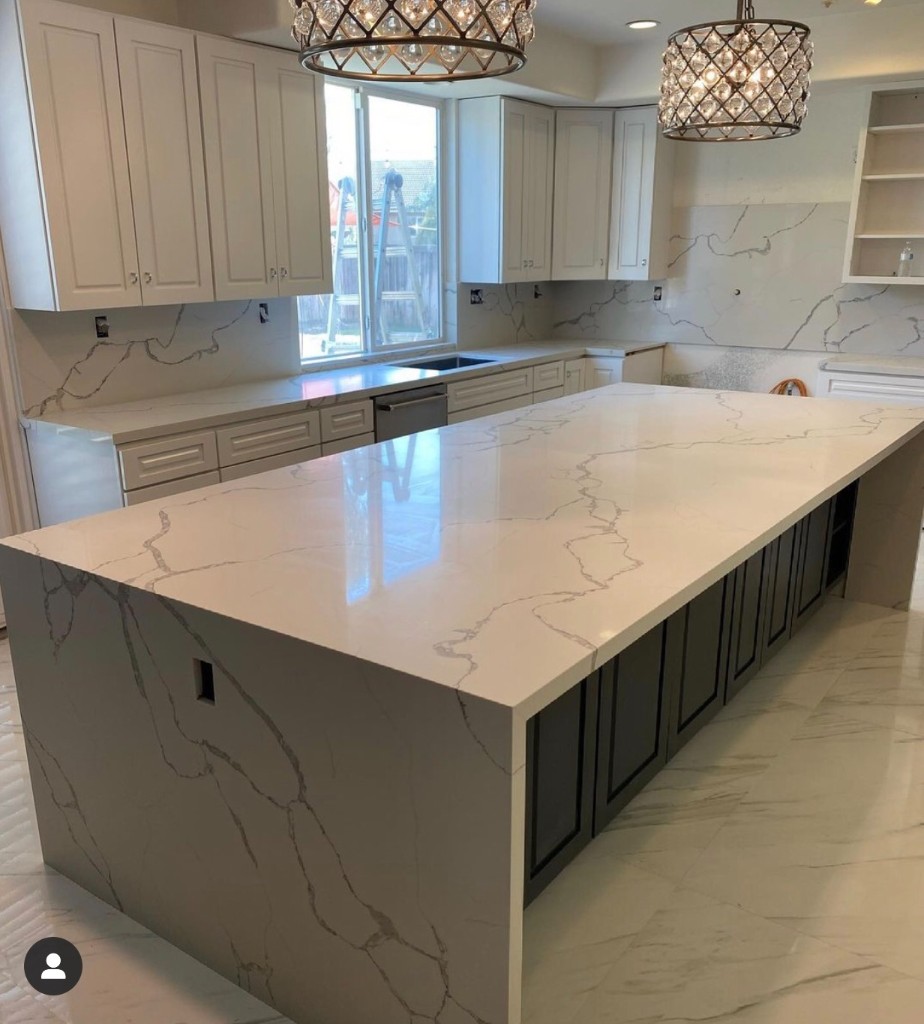 Completed waterfall island kitchen remodel with dark island base