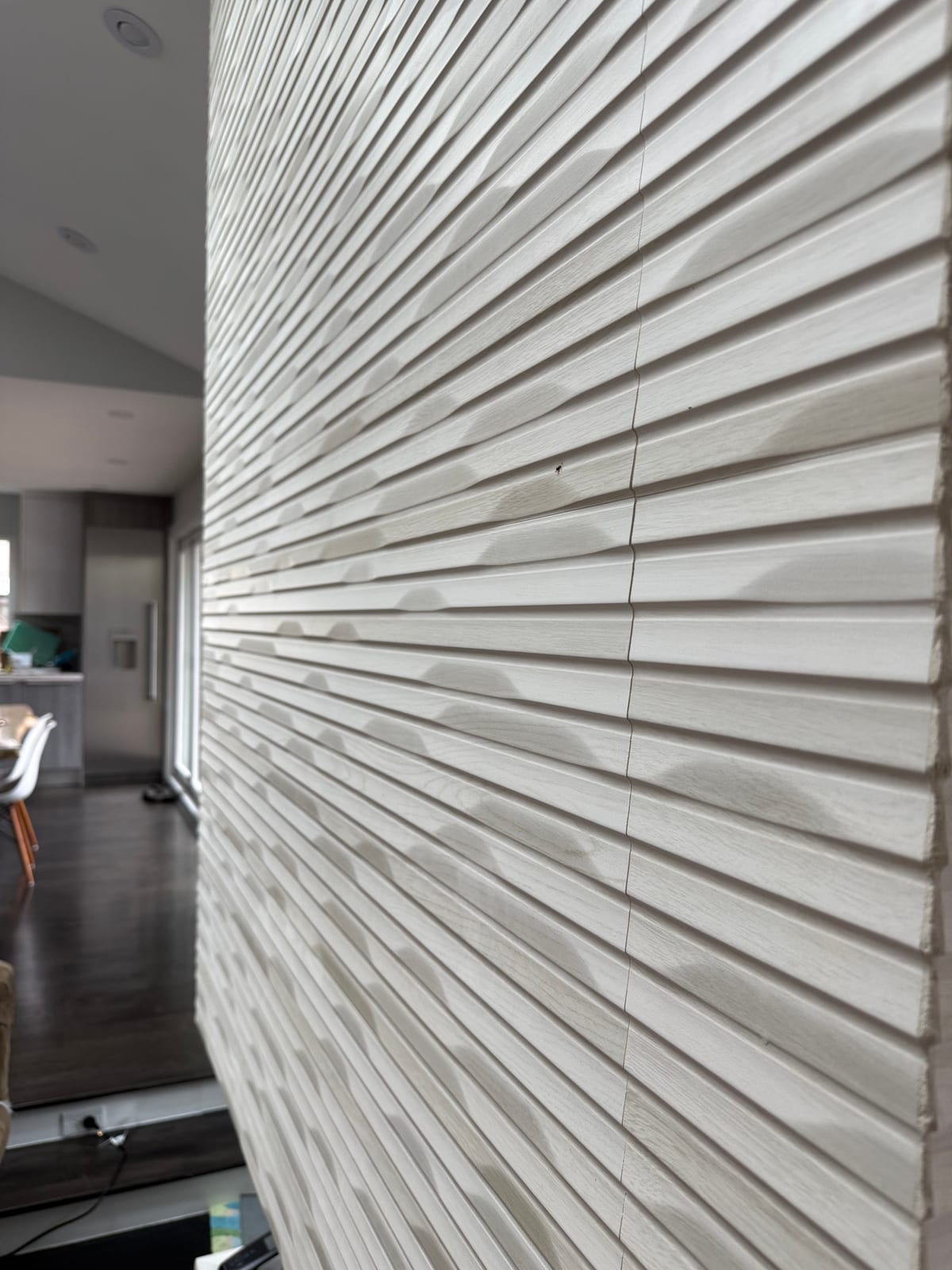 Textured feature wall finish in remodeled living space