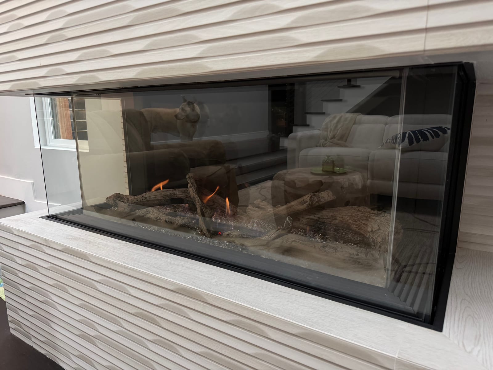 Linear gas fireplace in textured feature wall